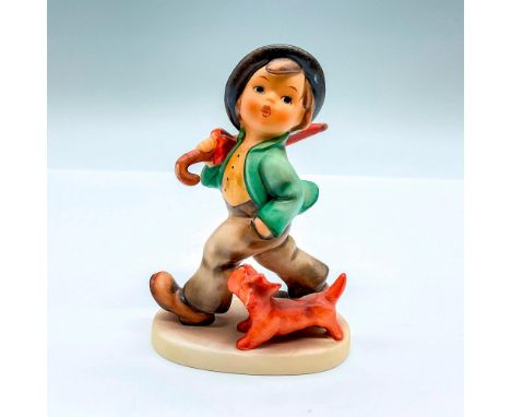 Hand painted figure of a young man walking with his dog. Goebel backstamp. This item has its original box: 7.5"L x 5.25"W x 4