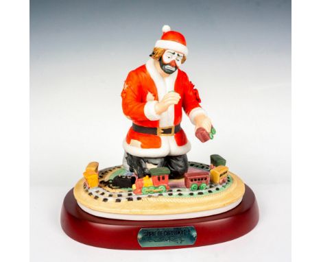 Limited edition, hand painted bisque porcelain depicting figural clown Weary Willie Santa playing with a toy train set. Rests