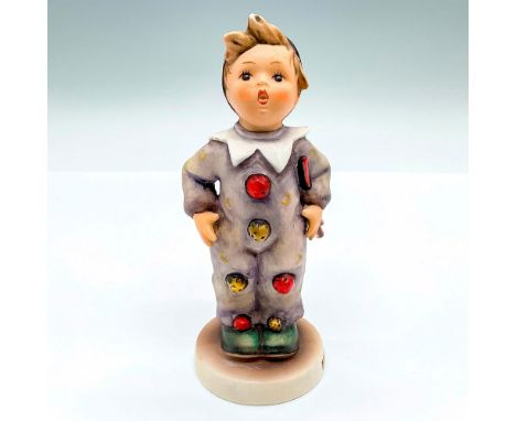 Hand painted figure of a young clown with red and yellow pom-poms. Goebel backstamp. Artist: M.I. HummelIssued: c. 1964-1972D