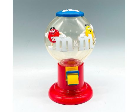 Clear plastic bubble top with M&amp;M characters on front. Red base holds dispenser funnel and latch. Mars Inc. impressed mar