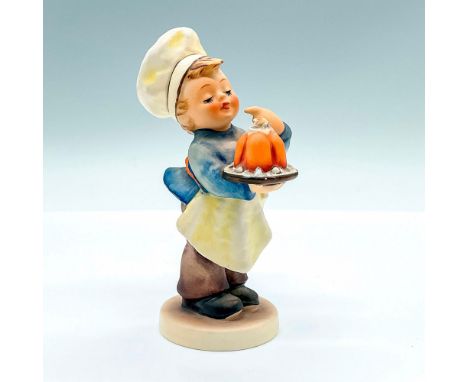 Hand painted figure of a young boy in a chef attire. Goebel backstamp. Artist: M.I. HummelIssued: c. 1972-1979Dimensions: 3"L