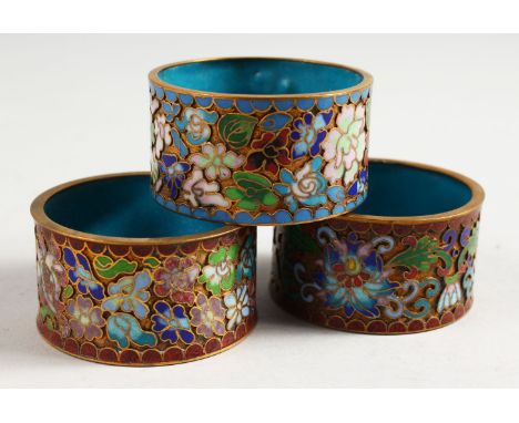 THREE JAPANESE MEIJI PERIOD CLOISONNE ENAMEL SERVIETTE RINGS, 5.3cm.