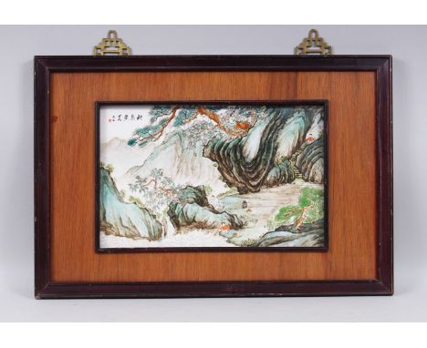 A CHINESE REPUBLICAN STYLE FRAMED PORCELAIN PANEL / TILE OF ROCKY OUTCROPS, the panel framed within a wooden frame, painted t