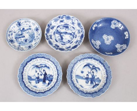 5 CHINESE KANGXI BLUE &amp; WHITE PORCELAIN SAUCERS, one pair and 3 singles, each decorated with varying scenes of figures in