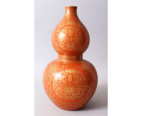 A GOOD CHINESE CORAL GROUND AND GILDED DOUBLE GOURD PORCELAIN VASE, The body of the vase decorated in gilt to depict bats, sy