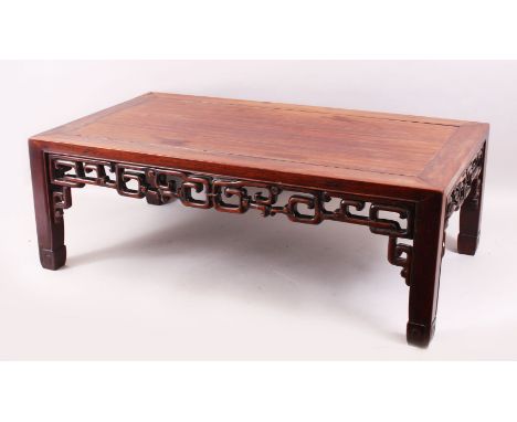 A GOOD 19TH CENTURY CHINESE HARDWOOD OPIUM / COFFEE TABLE, the side apron carved and pierced, stood on four straight but scro