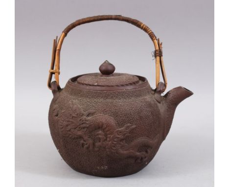 A JAPANESE MEIJI  PERIOD MOULDED CLAY / YIXING STYLE DRAGON TEAPOT / KETTLE, the body with nanako style ground with two mould