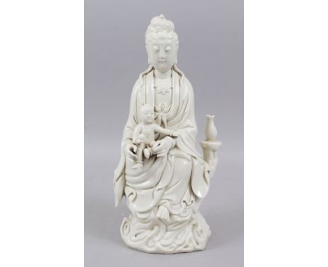 A GOOD CHINESE KANGXI STYLE BLANC DE CHINE PORCELAIN FUGURE OF GUANYIN &amp; BABY, the figure depicting a seated guanyin hold
