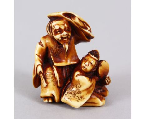 A GOOD JAPANESE MEIJI PERIOD CARVED IVORY NETSUKE OF MANZAI DANCERS, the pair both crouched, one covering his head, the other