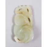 A GOOD 18TH / 19TH CENTURY CHINESE WHITE JADE PENDANT OF MUSHROOMS, 5.4cm wide X 2.5cm deep.