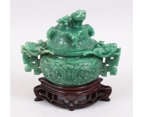 A GOOD 19TH / 20TH CENTURY CHINESE CARVED JADE / JADELIKE HARDSTONE LIDDED CENSER, carved with lion dogs and formal scrolling