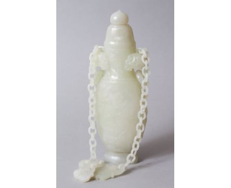 A GOOD QUALITY CHINESE CARVED CELADON JADE LIDDED URN / VASE, the vase with twin chilong style handles with rings, the body w