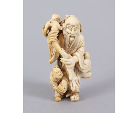 A GOOD JAPANESE MEIJI PERIOD CARVED IVORY NETSUKE OF A MAN WITH PEACH, stood with his branch bearing a peach, beside him a yo