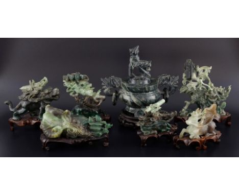 Six modern Chinese green/brown/white hardstone animal groups to include elephant, tiger and water buffalo, all on hardwood st