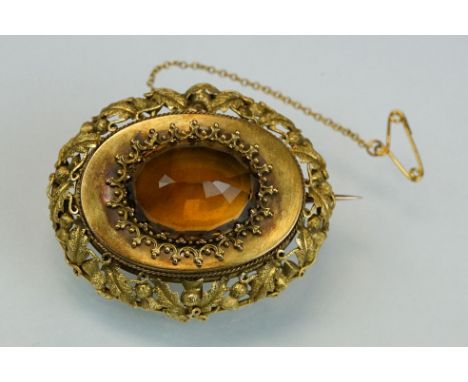 Victorian citrine yellow metal brooch, large oval rose cut citrine to centre measuring approx 22mm x 16.5mm, fancy claw set, 