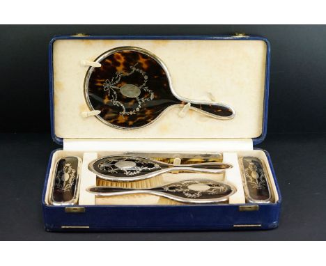 George V Harrods silver and tortoiseshell five piece dressing table set, with inlaid floral and bow decoration, comprising a 