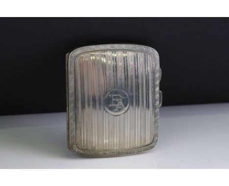 Silver cigarette case, engine turned decoration with Greek key border, initialled cartouche to the centre, gilt interior, mak