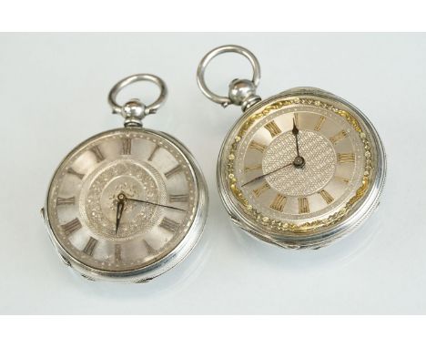 Two open faced fine silver cased key-wind pocket watches with engine turned dials, to include an example with yellow metal Ro