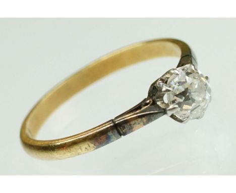 Diamond solitaire 18ct yellow gold platinum set ring, the round old cut diamond weighing approx 0.65 carat, claw set, assesse