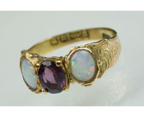 Mid Victorian amethyst and opal 15ct yellow gold three stone ring, the centre oval mixed cut amethyst measuring approx 7mm x 