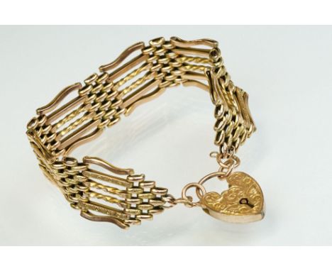 Late Victorian/ Edwardian 9ct gold gate link bracelet with padlock clasp, the bracelet with plain polished and textured links