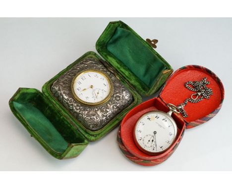 Late Victorian silver cased travel clock, the case with repoussé floral and foliate decoration, white enamel dial (af) and se