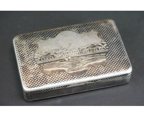Russian niello silver snuff box, the lid depicting city buildings to mountainous backdrop, the sides and base with chequerboa