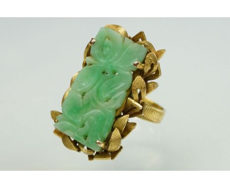 Jade 14ct yellow gold ring, carved rectangular jade panel, the jade measuring approx 26mm x 12mm, stylised leaf surround, tex
