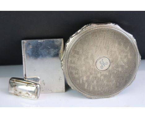 Elizabeth II Silver powder compact with all-over engine turned decoration and scalloped rim, London 1967, 7.5cm wide, togethe