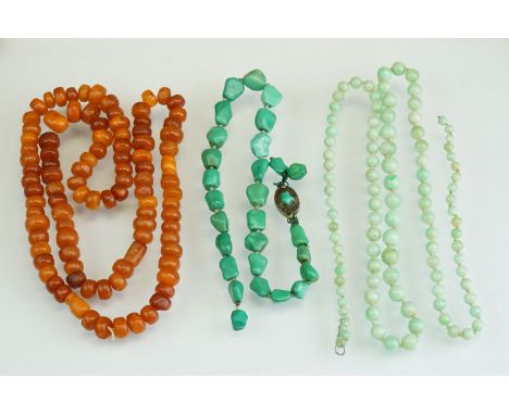 Three bead necklaces: an amber bead necklace, length approx 78cm; a string of jade beads (af) and a string of turquoise beads