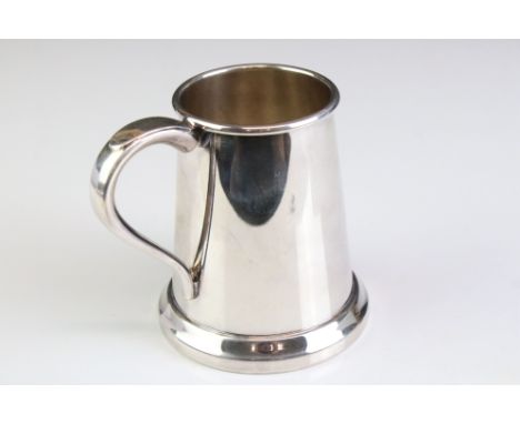 Elizabeth II silver tankard of plain polished form, raised on a circular foot, moulded upper rim, with presentation inscripti