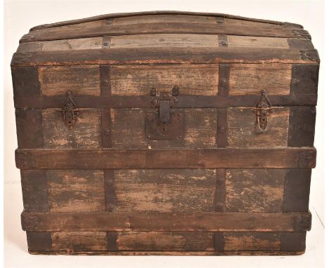 A late 19th Century seaman's pine domed trunk having original canvas cladding, bound in wood and metal. H=60, W=78, D=50cm