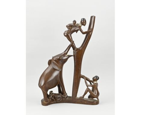 Large African wooden figure. 20th century. Hunter, elephant hunting, and mother with child in tree. Dimensions: H 52 cm. In g