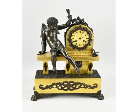 Antique French empire mantel clock. Gilded + burnished patina. With Amor putti and torch. Titled: Amour sans partage. Circa 1