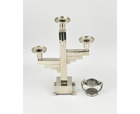Two parts chrome/metal Bauhaus. 1x Art deco candlestick, circa 1920. 1x Art deco tazza, marked, with figure. Size: 7 - 33 cm.