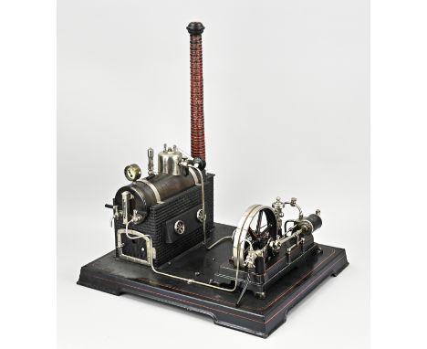 Very well maintained antique tin Doll steam engine with original polychromy. Germany. Circa 1910. Dimensions: 44 x 38 x 33 cm