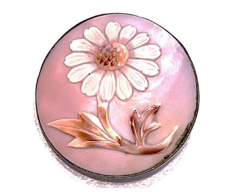 1 Medium size 19th century pictorial shell button.This beautifully carved Cowrie shell set in metal depicts a detailed flower