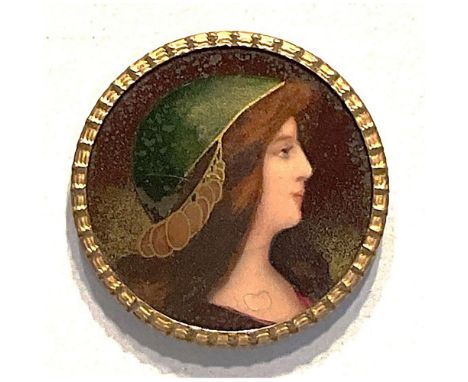 1 large early 20th century colorful ladies head button.This design in the Art Nouveau style is a colorful lithograph under a 