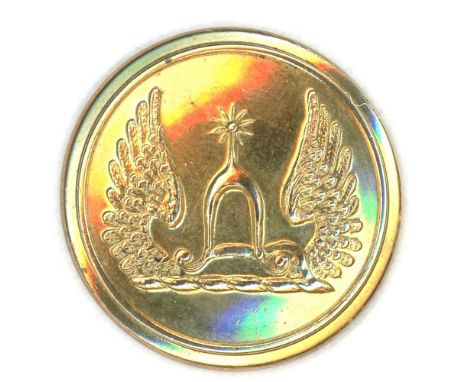A medium size 19th century brass family crest button.Here is a beautiful brass crest with an unusual design depicted on it. F