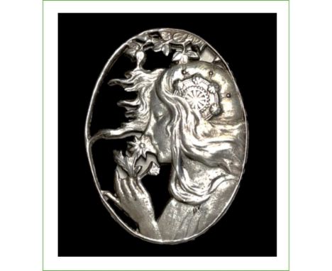 1 Large early 20th century pierced oval Art Nouveau button.This detailed and brilliant silver button shows a flowing haired w