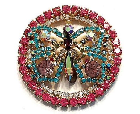 1 extra large 20th C. pierced multi colored paste jewel button.IN our 2023 fall auction we featured a frog from this set and 