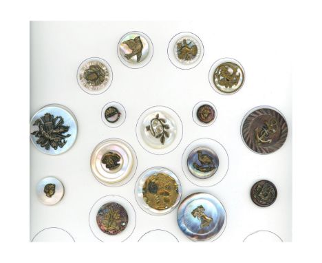 16 S/M/L 19th century pearl buttons with metal escutcheons.In this lot you will find silver escutcheons, brass escutcheons, a