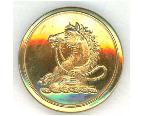 A medium 19th C. brass family crest button with a horse head.This gilded brass family crest depicts a horse head with its rid