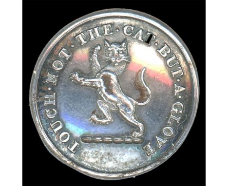 A medium size 19th C, silvered family crest button with a CAT.This very cool example of a 19th century crest button depicts a