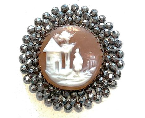 1 Large medium 19th century carved helmet shell button.From the collection of the late Shirley Case who wrote the NBS pearl c