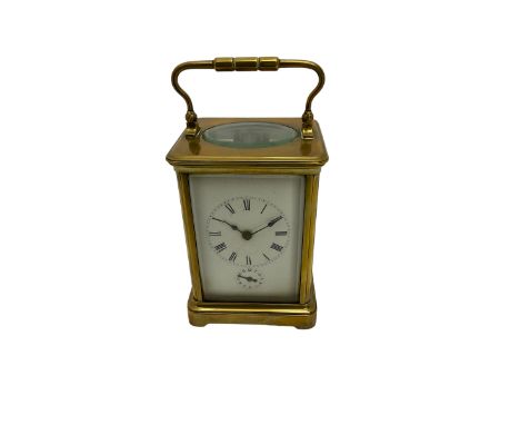 A late 19th century French corniche cased carriage clock with an eight-day movement and alarm sounding on a steel gong, with 