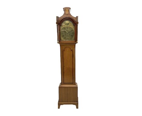 An oak longcase with mahogany cross banding and inlay, pagoda pediment with an inlaid oval and central ball and spire finial,