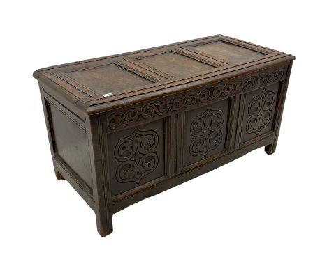 18th century oak blanket chest, triple panelled lid over triple panel front, the front carved with stylised foliate motifs, m