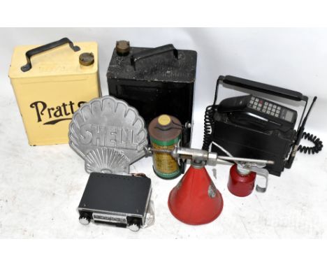 A quantity of automobile related items including a Pratts and another petrol can, a Shell aluminium sign, a Duckhams oil can,