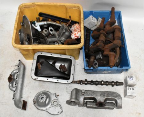 A selection of classic car engine parts, mostly Morris and Austin, including radiator parts, crankshaft, flywheel, clutch pla